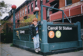 young boy by the Carroll Street subway stop in Brooklyn
