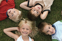 Youthfest at SUNY Rockland; kids lying in the grass