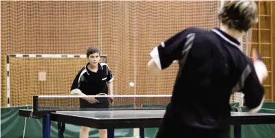 ping pong tournament; teens playing table tennis