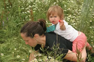 mom and child picking berries