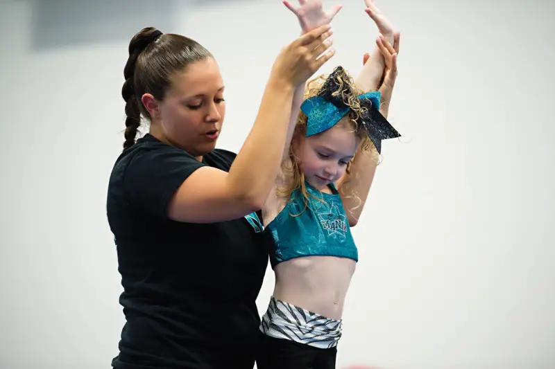 coach and athlete working on tumbling skills