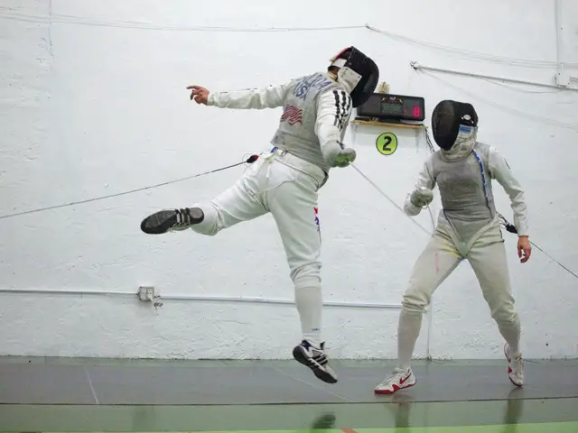 Kids practice fencing