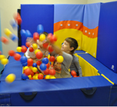 child in ball pit