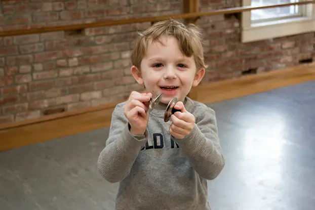 boy with finger cymbols