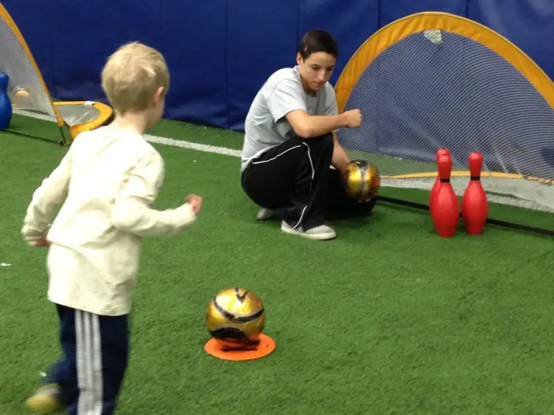 child playing soccer